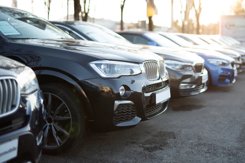 Row of cars in parking lot